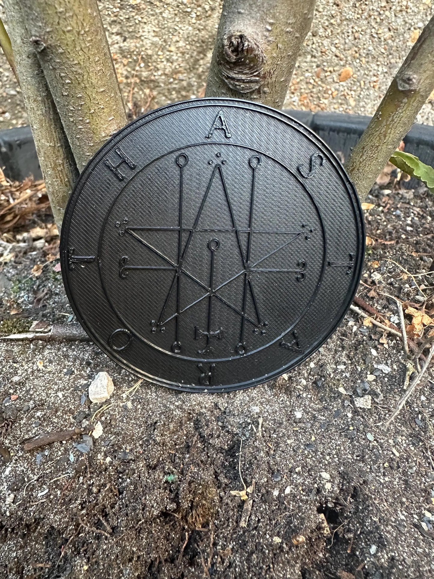 Matte black King Solomon’s Lesser Key Goetia seal ritual tool with intricate infernal sigil design.
